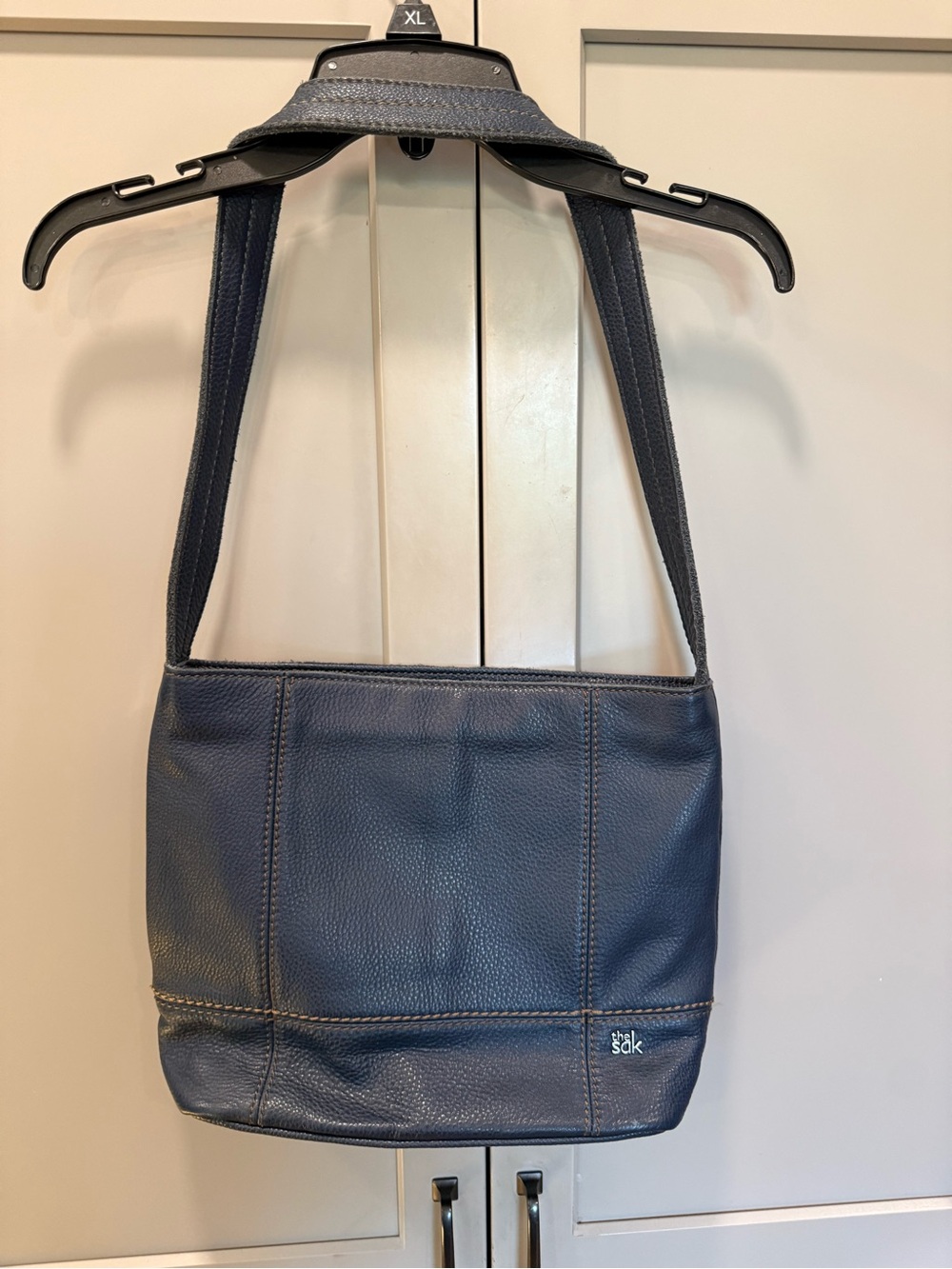 The Sak Navy Leather Messenger Bag with Wide Strap